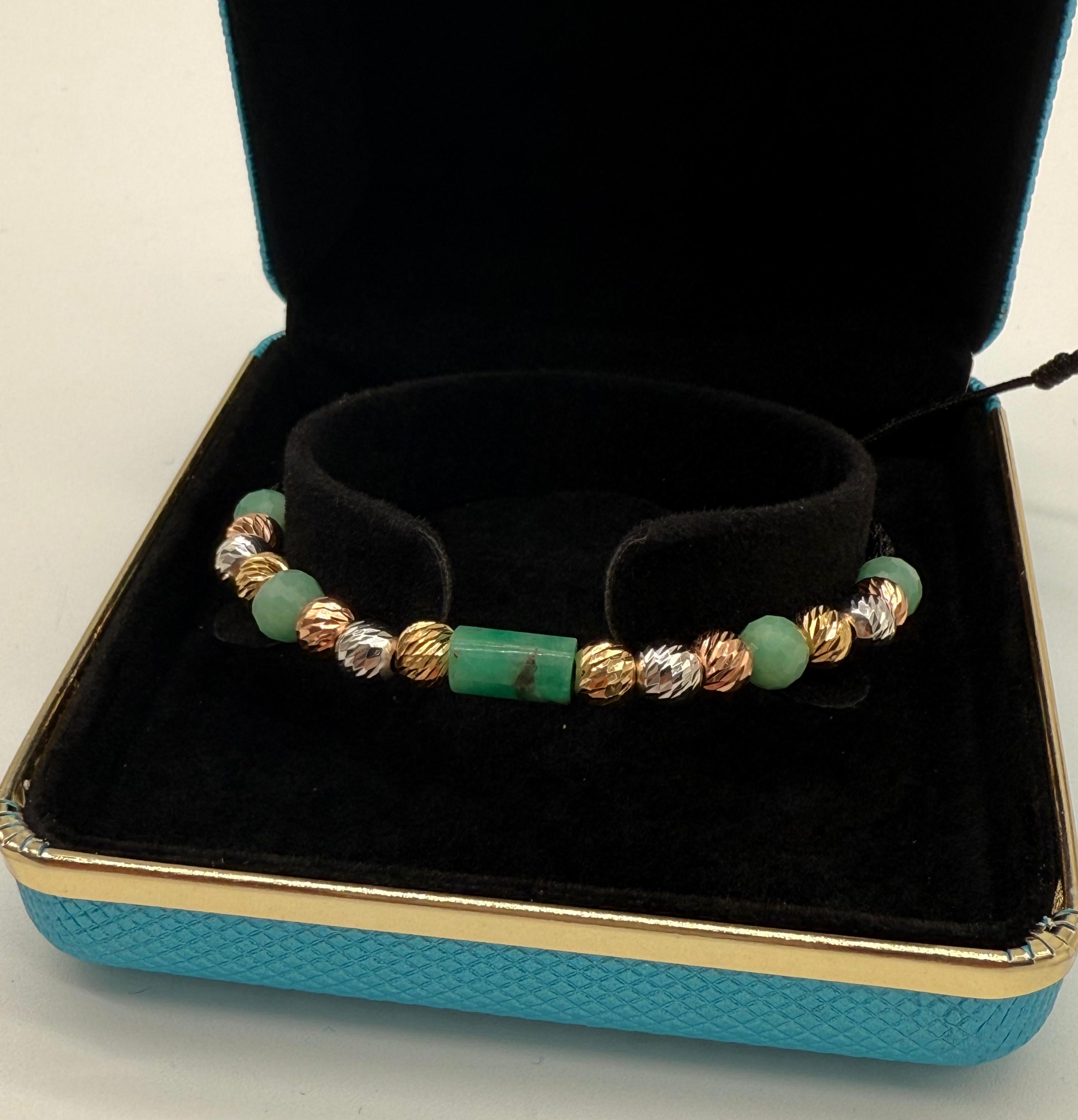 pulsera elaborada con balines diamantados 6mm en los tres oros y esmeraldas 100% naturales.